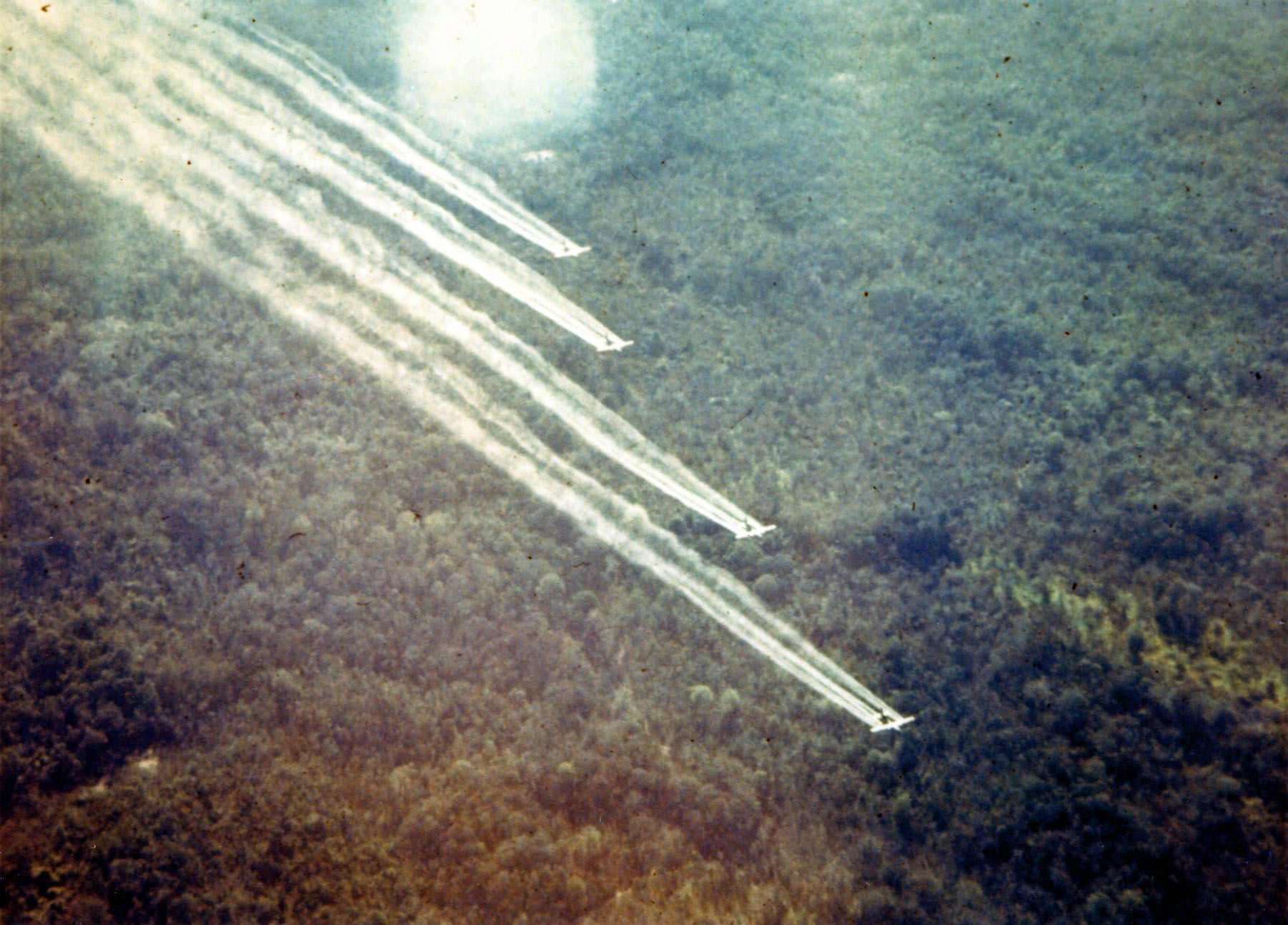 Photo of UC-123 airplanes spraying herbicides in central South Vietnam.